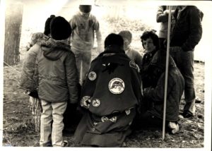 Cub Scouts Sit Around Fire at Boy Scouts Catholic Retreat