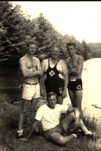 Camp Russell Leaders Pose in Swimwear Near Waterfront