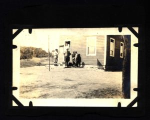 Scouts pose Outside Camp Russell Headquarters.