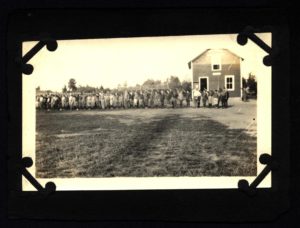 Scouts Stand in Front of Camp Russell Headquarters