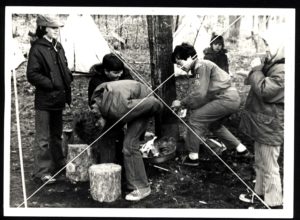 Scouts Huddle Around Fire