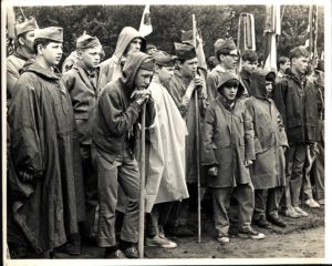 Scouts Stand in Rain at Flag Ceremony