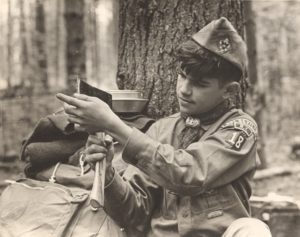 Scout Test The Blade on His Hatchet