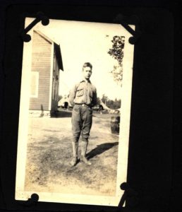 Scout Stands Outside Camp Russel Headquarters